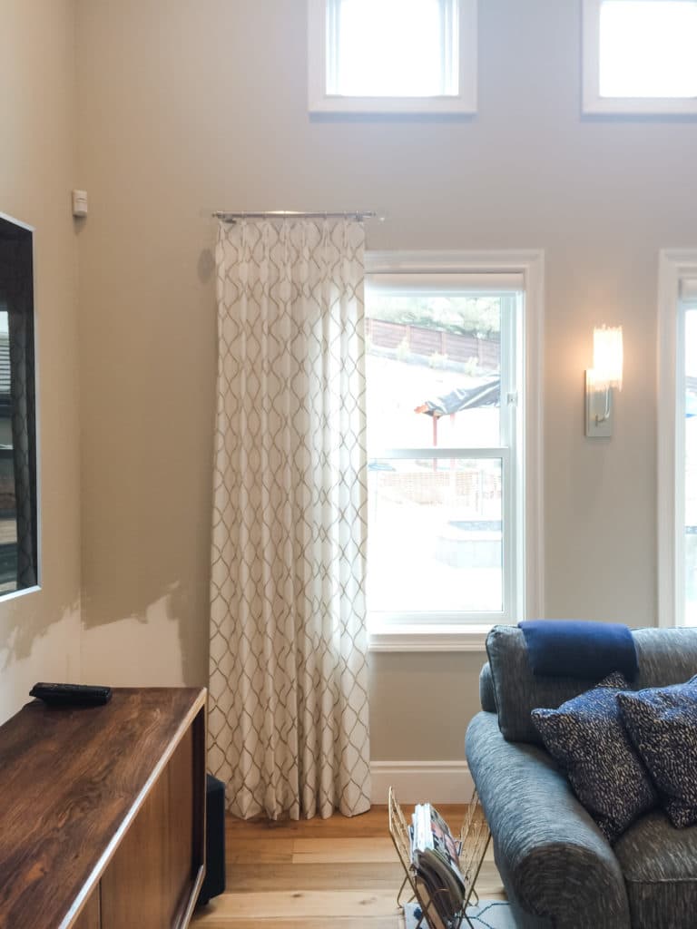 Motorized shades disappear, leaving the focus on the drapes