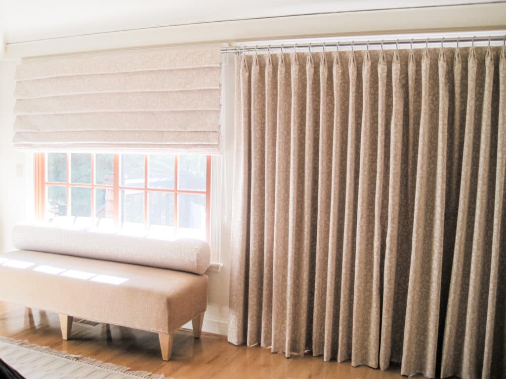 Matching shade and drape work together to darken this Lafayette main bedroom