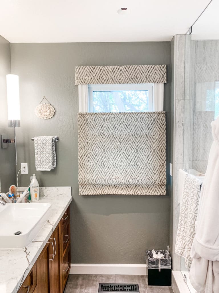 A patterned shade brings a fun focal point to the bathroom