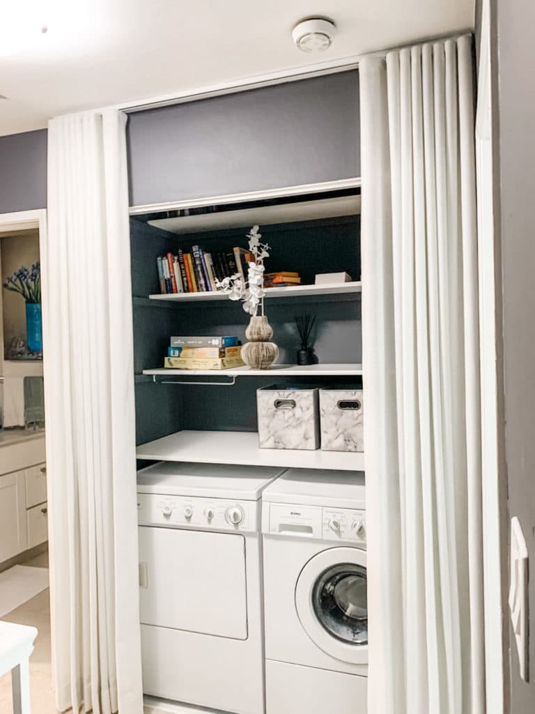 Unusual and creative use of drapes to conceal laundry area